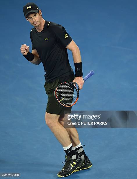 Britain's Andy Murray reacts to a point against Andrey Rublev of Russia during their men's singles match on day three of the Australian Open tennis...