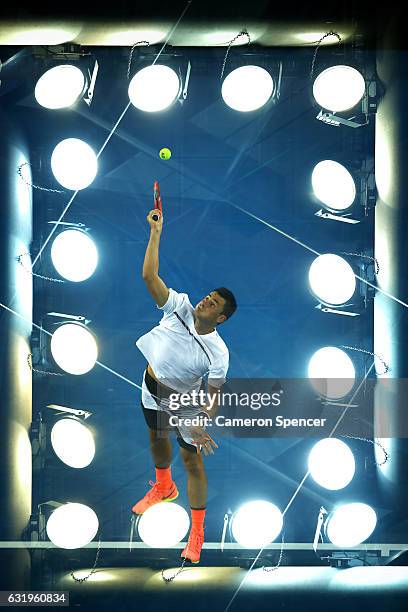 Bernard Tomic of Australia serves in his second round match against Victor Estrella Burgos of The Dominican Republic on day three of the 2017...