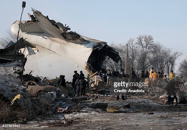 Search and rescue staff continue to work at the site of a cargo plane crash near Bishkek, Kyrgyzstan on January 18, 2017. The Boeing 747-400 operated...