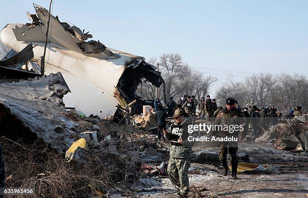 Search and rescue staff continue to work at the site of a cargo plane crash near Bishkek, Kyrgyzstan on January 18, 2017. The Boeing 747-400 operated...