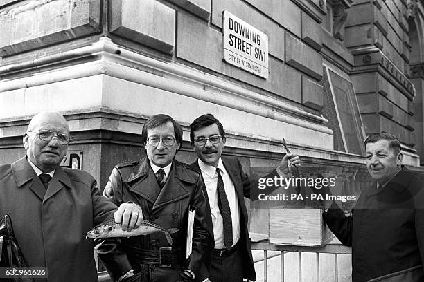 Leaders of redundant trawlermen in Downing Street today to deliver a box of fish to No. 10 before going to meet Employment Minister John Selwyn...