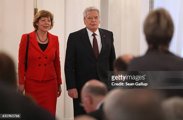 German President Joachim Gauck, accompanied by First Lady Daniela Schadt, arrives to give a speech to mark the end of his term as president at...