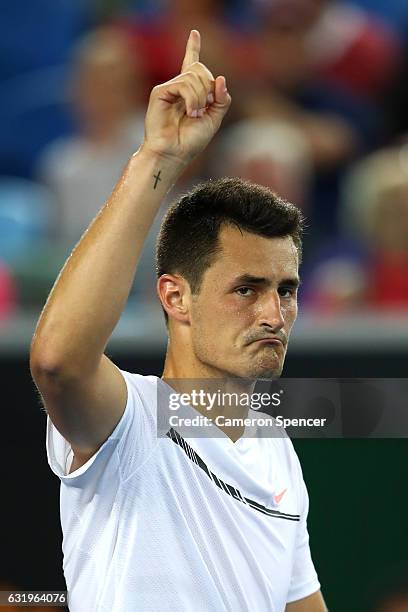 Bernard Tomic of Australia celebrates winning his second round match against Victor Estrella Burgos of The Dominican Republic on day three of the...