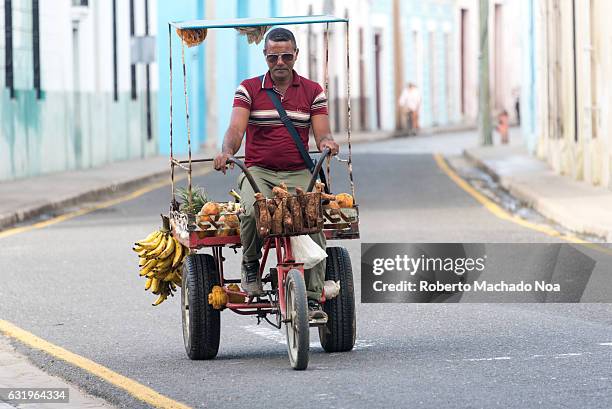 Self employed man selling fruits and vegetables in the city. Cuban real people lifestyle in the Caribbean Island.