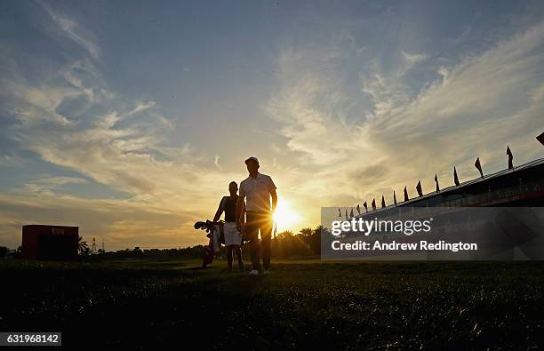 Rickie Fowler of the USA and his caddie Joe Skovron during the Pro Am event prior to the start of the Abu Dhabi HSBC Golf Championship at Abu Dhabi...