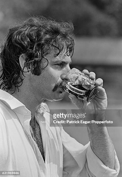 Australian fast bowler Dennis Lillee drinking coca cola from beer mug following a practice session at Lord's cricket ground prior to the 2nd Test...