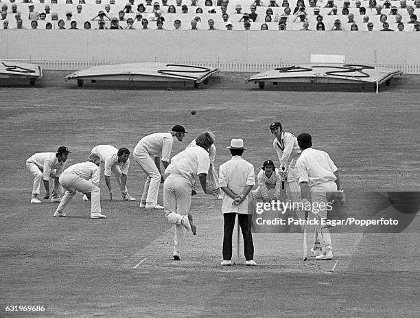 The England close fielders are poised for a catch as Phil Edmonds bowls to Australian batsman Doug Walters on a hat-trick ball during the second day...