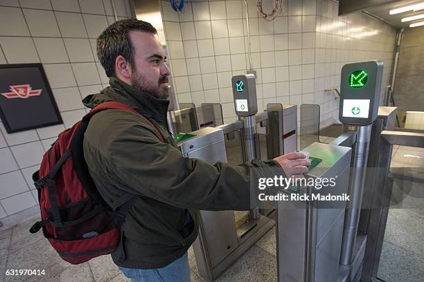 Yigit Inant tries to pass through the Presto access to the Eastbound platform of Line 2 at Dufferin , but the gate wouldn't open despite the green...