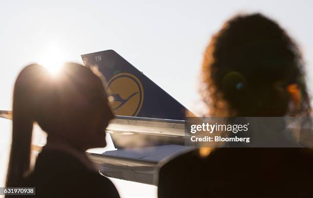 The Deutsche Lufthansa AG logo sits on the tail fin of a passenger jet as seen from the new VIP lounge at Frankfurt airport, operated by Fraport AG,...