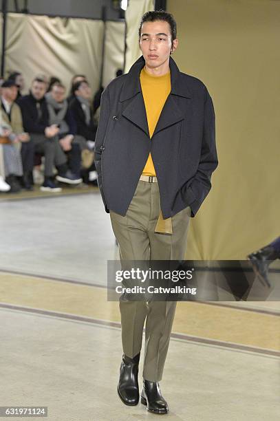 Model walks the runway at the Lemaire Autumn Winter 2017 fashion show during Paris Menswear Fashion Week on January 18, 2017 in Paris, France.