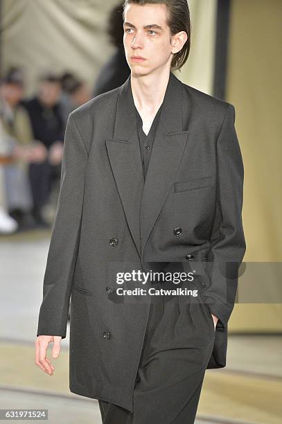 Model walks the runway at the Lemaire Autumn Winter 2017 fashion show during Paris Menswear Fashion Week on January 18, 2017 in Paris, France.