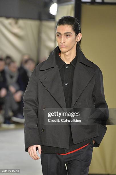 Model walks the runway at the Lemaire Autumn Winter 2017 fashion show during Paris Menswear Fashion Week on January 18, 2017 in Paris, France.