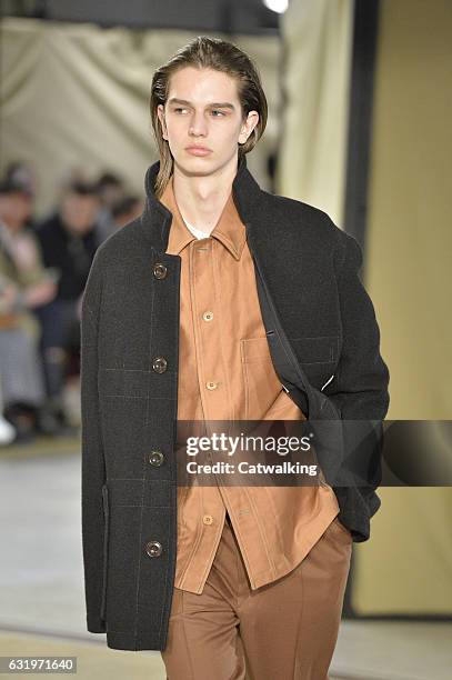 Model walks the runway at the Lemaire Autumn Winter 2017 fashion show during Paris Menswear Fashion Week on January 18, 2017 in Paris, France.