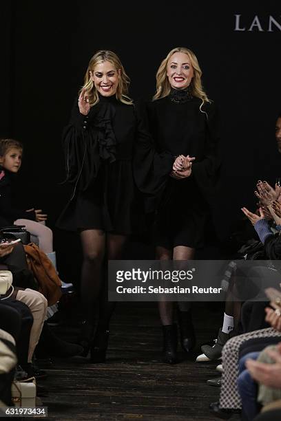 Designers Gelena Roizen and Lana Mueller acknowledge the audience following her show during the Mercedes-Benz Fashion Week Berlin A/W 2017 at Soho...