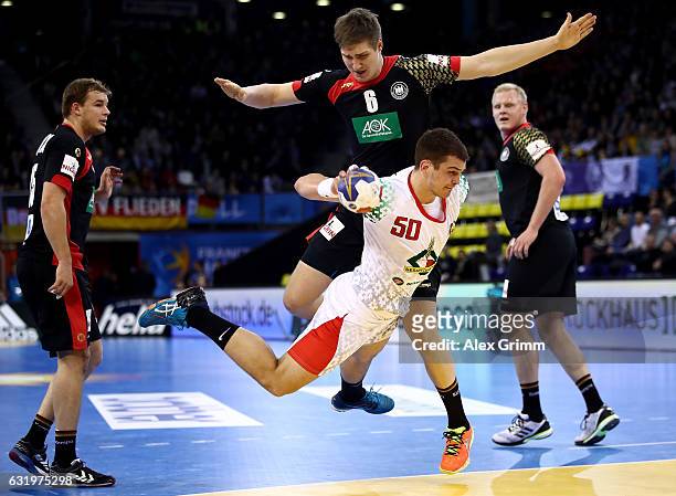 Artsem Karalek of Belarus challenges Finn Lemke of Germany during the 25th IHF Men's World Championship 2017 match between Belarus and Germany at...