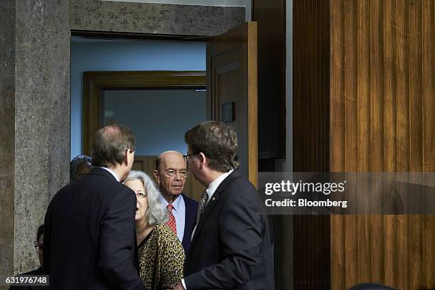 Billionaire investor Wilbur Ross, commerce secretary nominee for U.S. President-elect Donald Trump, center, arrives for a Senate Commerce, Science...