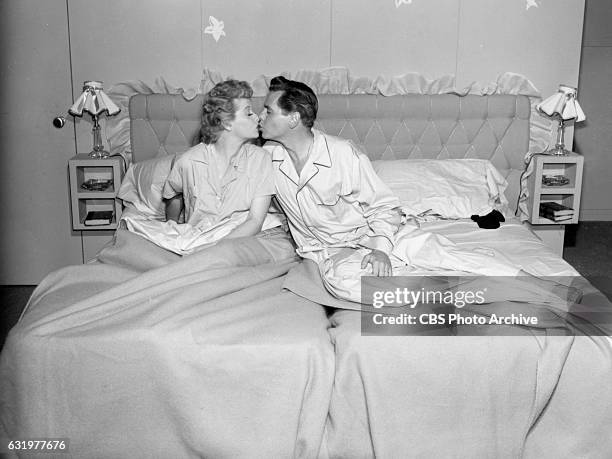 Lucille Ball and Desi Arnaz portray Lucy Ricardo and Ricky Ricardo in the CBS television series "I Love Lucy." They kiss while in bed. January 1,...