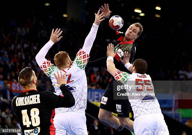 Aliaksandr Tsitou of Belarus challenges Julius Kuehn of Germany during the 25th IHF Men's World Championship 2017 match between Belarus and Germany...