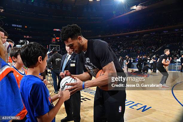 Courtney Lee of the New York Knicks signs autographs before the game against the Atlanta Hawks on January 16, 2017 at Madison Square Garden in New...