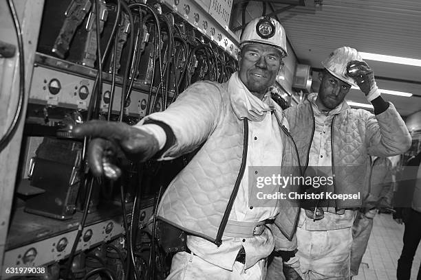 Holger Badstuber and Ralf Faehrmann pose during a visit of FC Schalke 04 at Prosper Haniel Mine on January 18, 2017 in Bottrop, Germany.