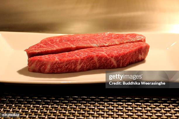 Slices of Kobe beef meat pictured in plate as arrange steaks in a Kobe Plaisir restaurant on January 18, 2017 in Kobe, Japan. Kobe city is home to...