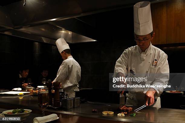 Chef prepare Kobe beef steaks in a Kobe Plaisir restaurant on January 18, 2017 in Kobe, Japan. Kobe city is home to renowned Japanese wagyu beef...