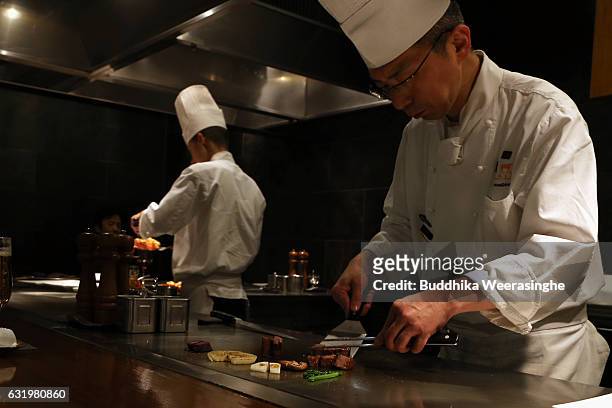Chef prepare Kobe beef steaks in a Kobe Plaisir restaurant on January 18, 2017 in Kobe, Japan. Kobe city is home to renowned Japanese wagyu beef...