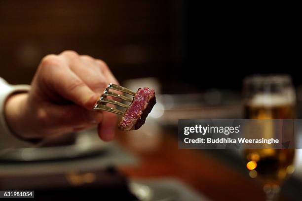 Foreign customer tastes Kobe beef steaks in a Kobe Plaisir restaurant on January 18, 2017 in Kobe, Japan. Kobe city is home to renowned Japanese...