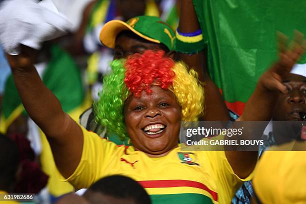 Cameroon supporter cheers for her team ahead of the 2017 Africa Cup of Nations group A football match between Cameroon and Guinea-Bissau at the Stade...