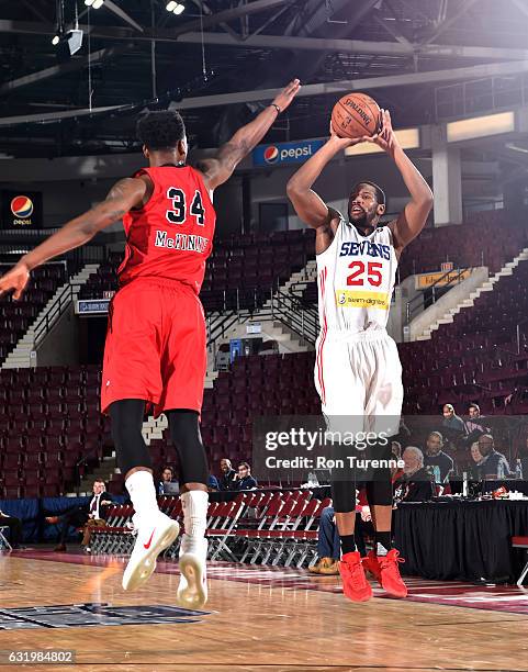 Dionte Christmas of the Delaware 87ers shoots the ball against Alfonzo McKinnie of the Windy City Bulls as part of 2017 NBA D-League Showcase at the...