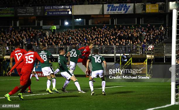 Lucas Leiva of Liverpool scores the opening goal with a header during The Emirates FA Cup Third Round Replay match between Plymouth Argyle and...