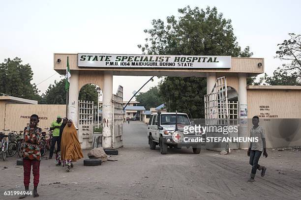 Red Cross vehicle leaves the Maiduguri State Specialist Hospital grounds on on January 18, 2017. At least 70 people have died in an Internally...