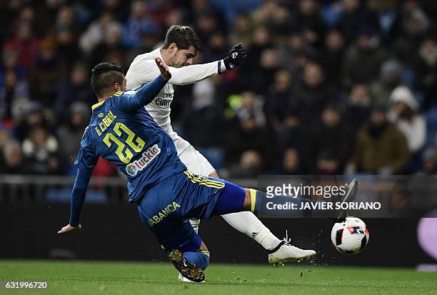 Celta Vigo's Argentinian defender Gustavo Cabral vies with Real Madrid's forward Alvaro Morata during the Spanish Copa del Rey quarter-final first...
