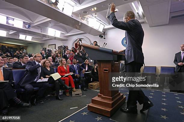 President Barack Obama waves at the conclusion of the last news conference of his presidency in the Brady Press Briefing Room at the White House...
