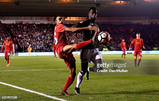 Trent Alexander-Arnold of Liverpool challenges Jordan Slew of Plymouth Argyle during The Emirates FA Cup Third Round Replay match between Plymouth...