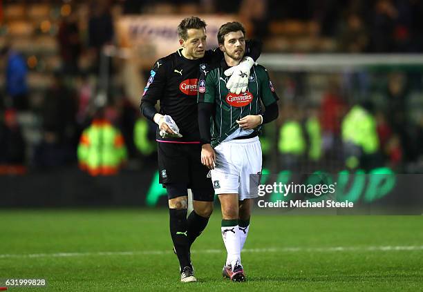 Luke McCormick of Plymouth Argyle and Graham Carey of Plymouth Argyle applaud supporters following defeat in The Emirates FA Cup Third Round Replay...