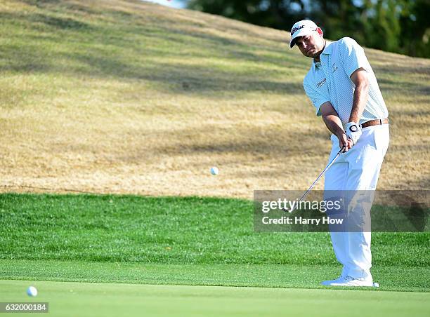 Bill Haas chips during practice for the CareerBuilder Challenge at PGA West on January 18, 2017 in La Quinta, California.
