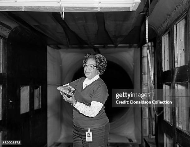 Mathmatician Mary Jackson, the first black woman engineer at NASA poses for a photo at work at NASA Langley Research Center in 1977 in Hampton,...