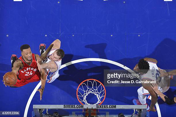 Norman Powell of the Toronto Raptors goes for the lay up during the game against Nik Stauskas of the Philadelphia 76ers on January 18, 2017 at Wells...
