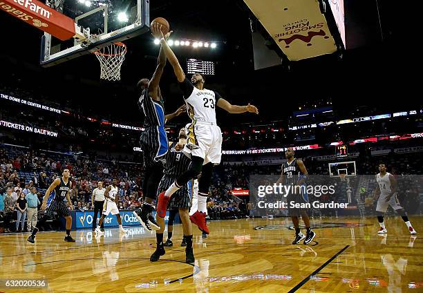 Anthony Davis of the New Orleans Pelicans of the New Orleans Pelicans is blocked by Serge Ibaka of the Orlando Magic during the first half at the...