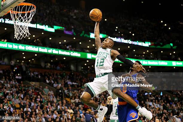Terry Rozier of the Boston Celtics takes a shot against Justin Holiday of the New York Knicks during the second half at TD Garden on January 18, 2017...