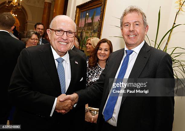 British Ambassador Kim Darroch greets former mayor of New York City Rudy Giuliani at an Afternoon Tea hosted by the British Embassy to mark the U.S....