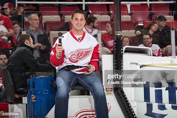 Detroit Tigers catcher James McCann rides the Zamboni during the second intermission of an NHL game between the Detroit Red Wings and the Boston...