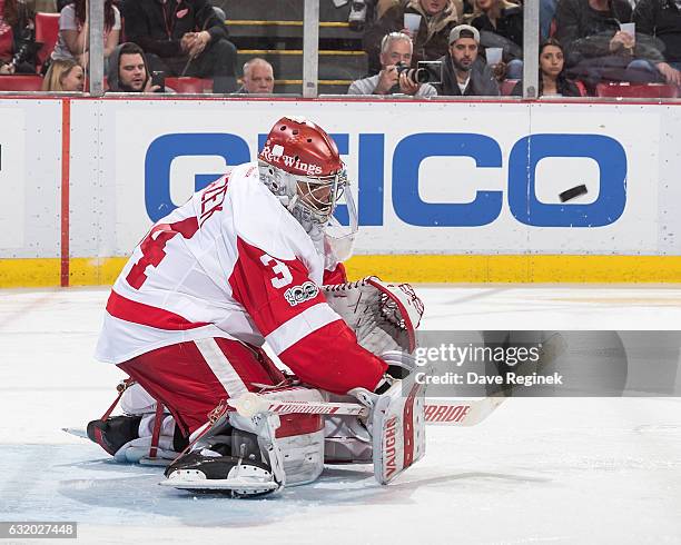 Petr Mrazek of the Detroit Red Wings blocks a shot during an NHL game against the Boston Bruins at Joe Louis Arena on January 18, 2017 in Detroit,...