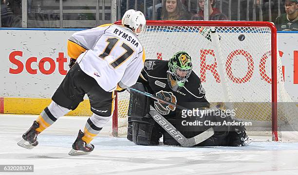 Drake Rymsha of the Sarnia Sting beats Tyler Parsons of the London Knights for the shoot-out winning goal in an OHL game at Budweiser Gardens on...