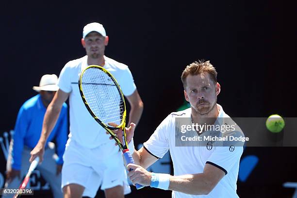 Johan Brunstrom of Sweden competes with Andreas Siljestrom of Sweden during their first round match against Marcelo Melo of Brazi and Lukas Kubot of...