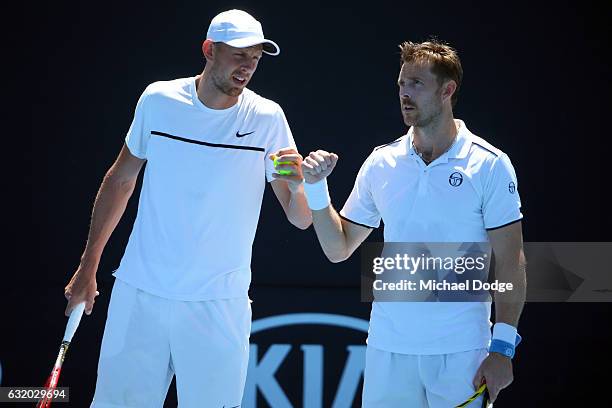 Johan Brunstrom of Sweden and Andreas Siljestrom of Sweden talk tactics during their first round match against Marcelo Melo of Brazi and Lukas Kubot...