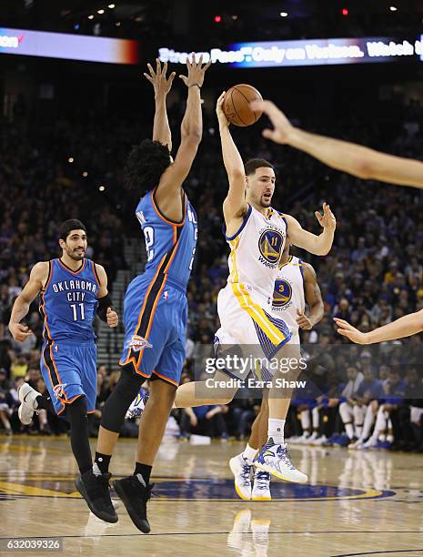 Klay Thompson of the Golden State Warriors looks to pass the ball against the Oklahoma City Thunder at ORACLE Arena on January 18, 2017 in Oakland,...
