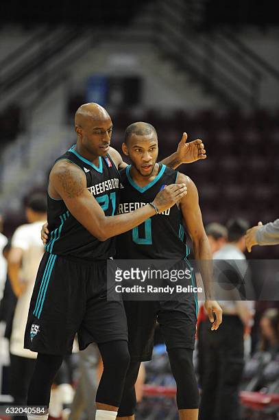 Damien Wilkins and Rasheed Sulaimon of the Greensboro Swarm hugs during the game against the Erie BayHawks as part of 2017 NBA D-League Showcase at...