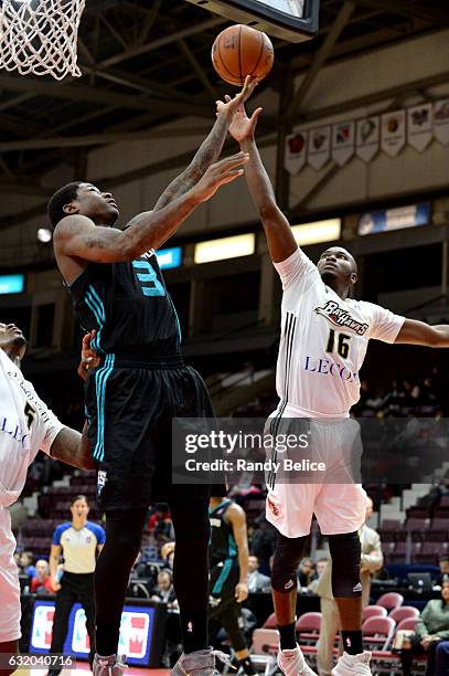 Archie Goodwin of the Greensboro Swarm and Michael Lyons of the Erie BayHawks jump for the ball as part of 2017 NBA D-League Showcase at the Hershey...